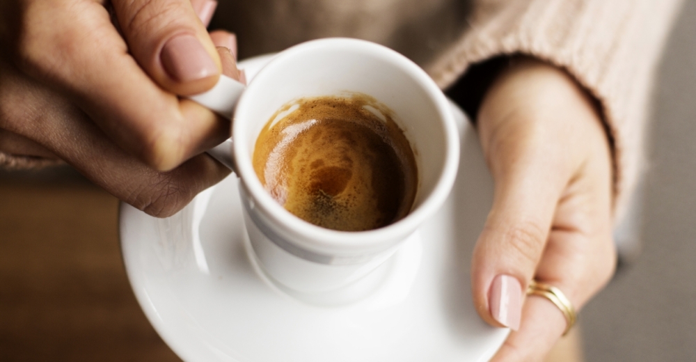 Coffee cup in the hands of a person