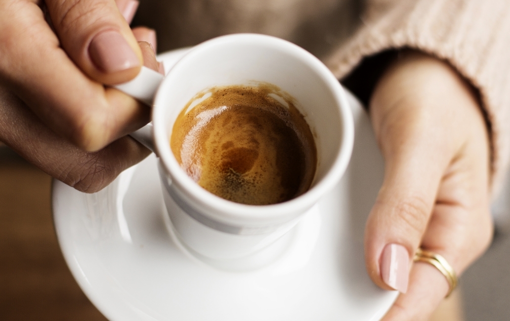 Coffee cup in the hands of a person