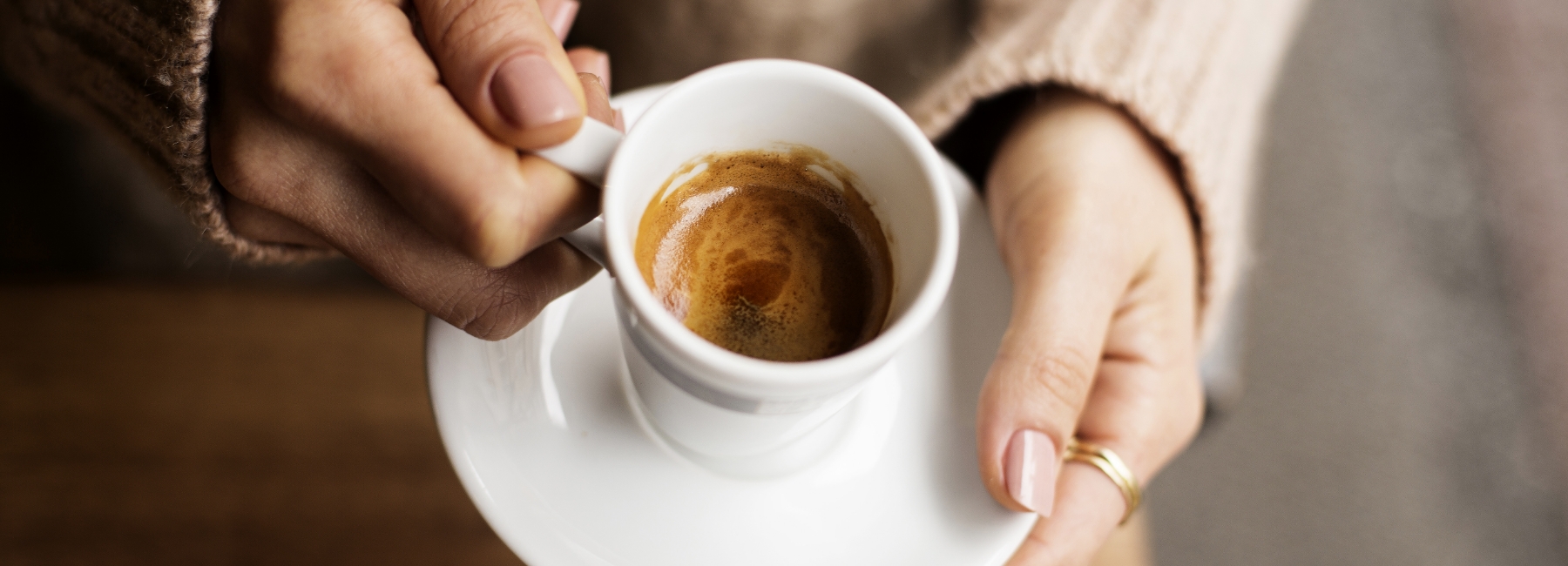 Coffee cup in the hands of a person