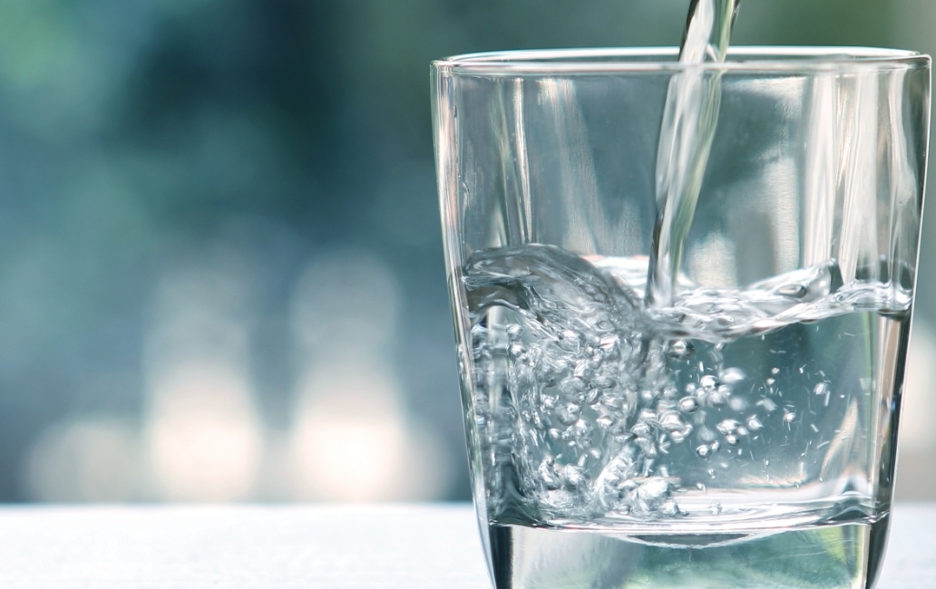 Glass of water filling up