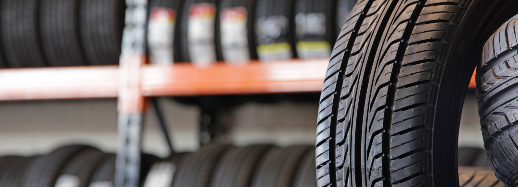 Tyre rack with several tyres in the foreground