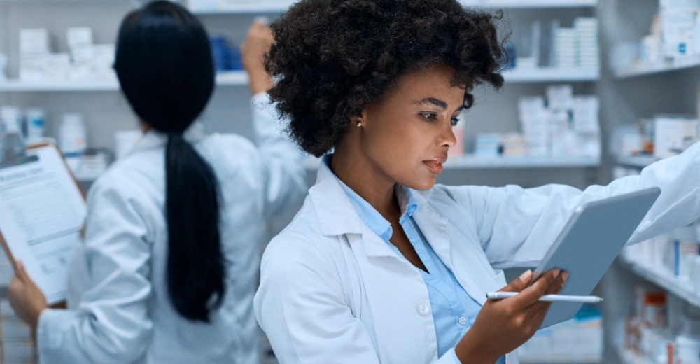 Pharmaceutical staff checking inventory