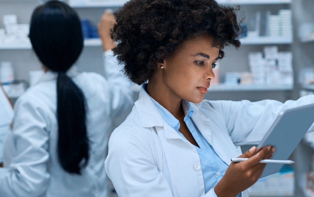 Pharmaceutical staff checking inventory