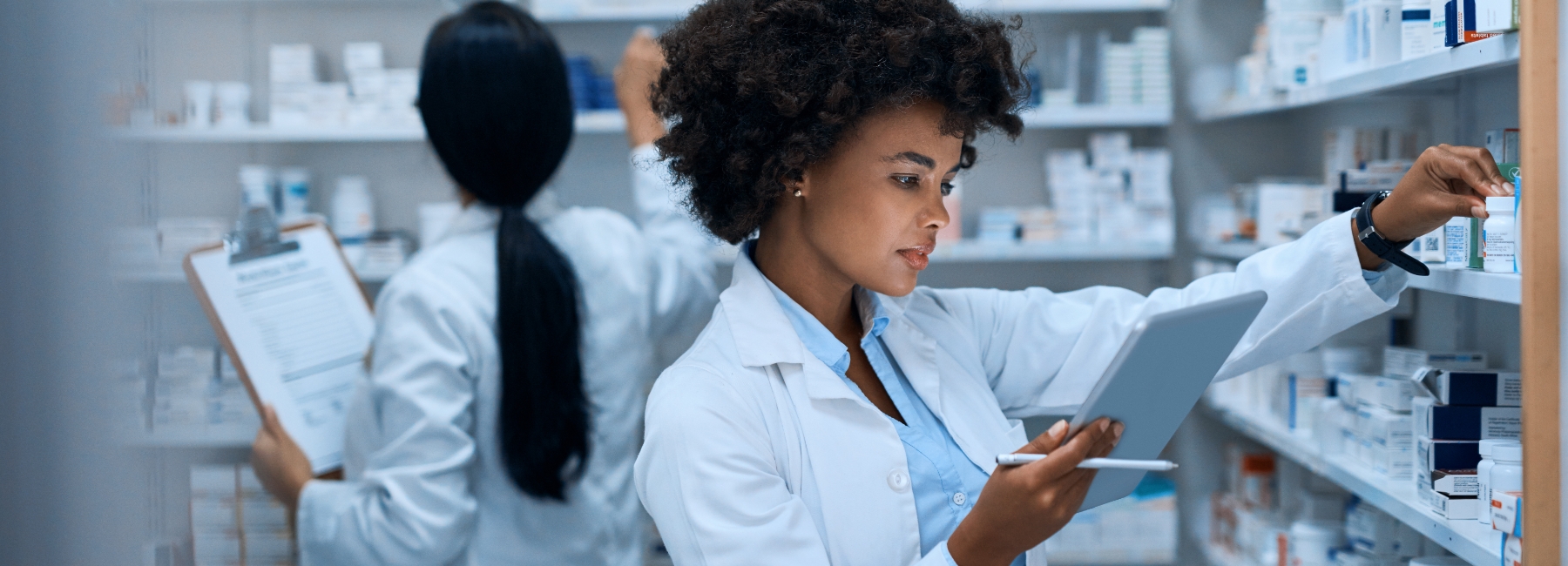 Pharmaceutical staff checking inventory