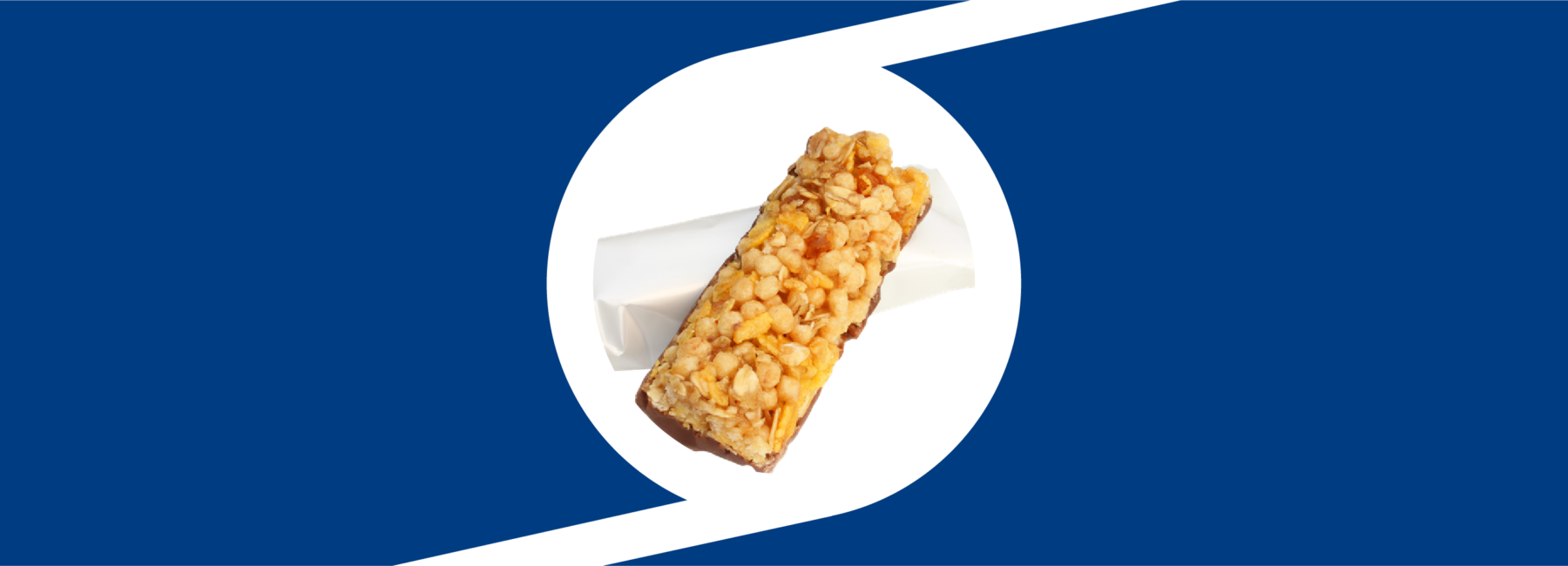 A granola bar placed on top of a blank white wrapper inside of the Taghleef monogram design element.